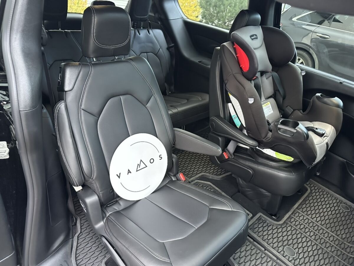 Free child seat installed in the Vamos Express airport shuttle minivan