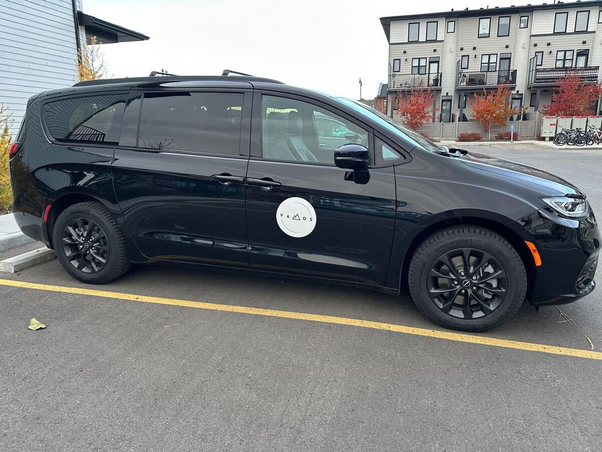 Vamos Express black Chrysler Pacifica minivan — Okotoks to Calgary Airport shuttle